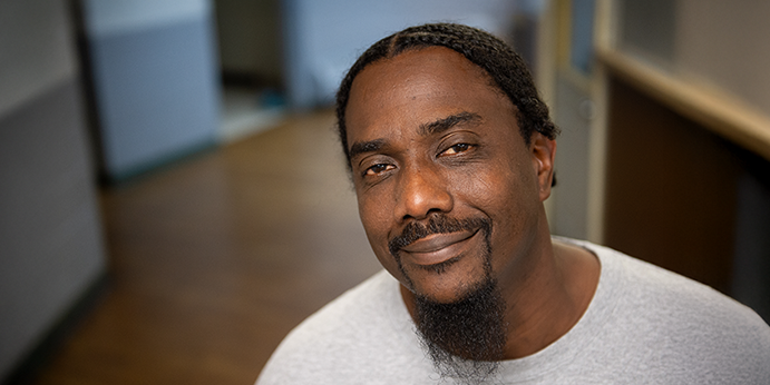 DRM-0805 HP-Banner-Image upclose headshot of an african american male smiling at the camera