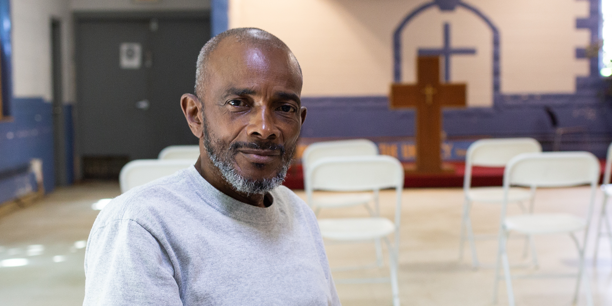 DRM-0818 HP-Banner-Image@3x older man in a gym setup as a chapel